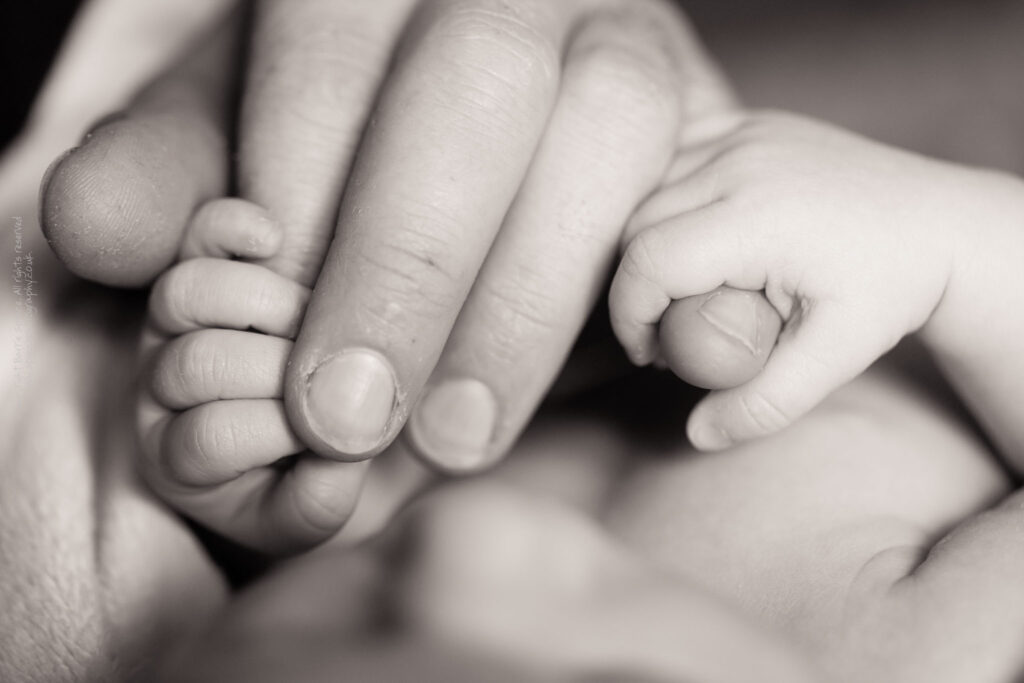 Baby Ruby holding Scott's hand Baby Ruby holding Scott's hand (black & white) / © Copyright 2011 Barrie Spence. All rights reserved.