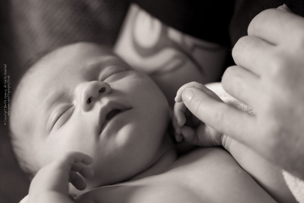 Scott holding Baby Ruby Scott holding Baby Ruby (black & white) / © Copyright 2011 Barrie Spence. All rights reserved.